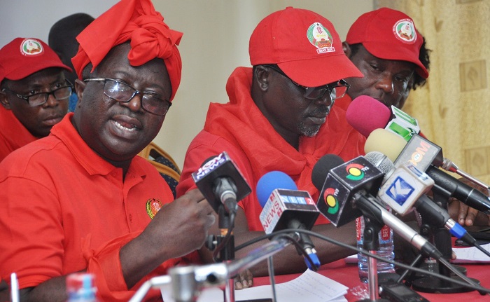 Mr Michael Adumatta Nyantakyi (right), General Secretary, PUWU, addressing the news conference. With him are Dr Yaw Baah (3rd left), Secretary General, TUC, and other members.  Picture: SAMUEL TEI ADANO